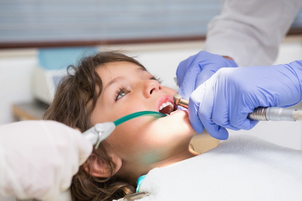 pediatric dentist examining